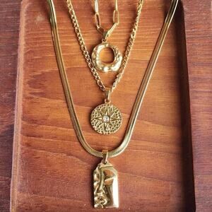 Abstract gold necklace trio